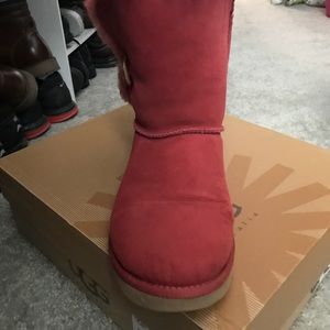 Woman’s red Ugg boots
